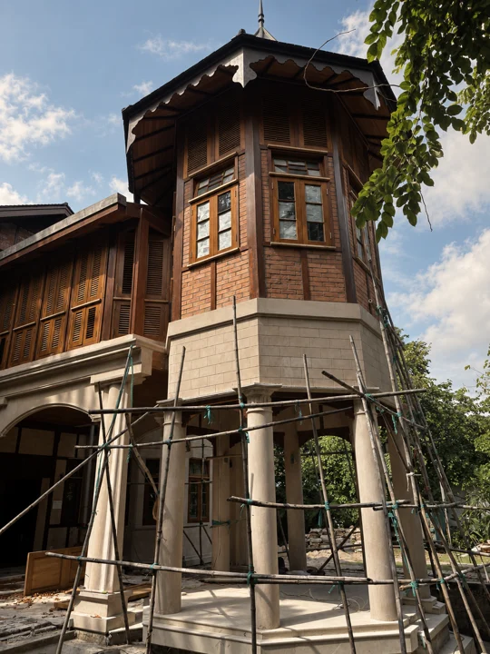A house under construction with scaffolding, timber shutters and stone columns