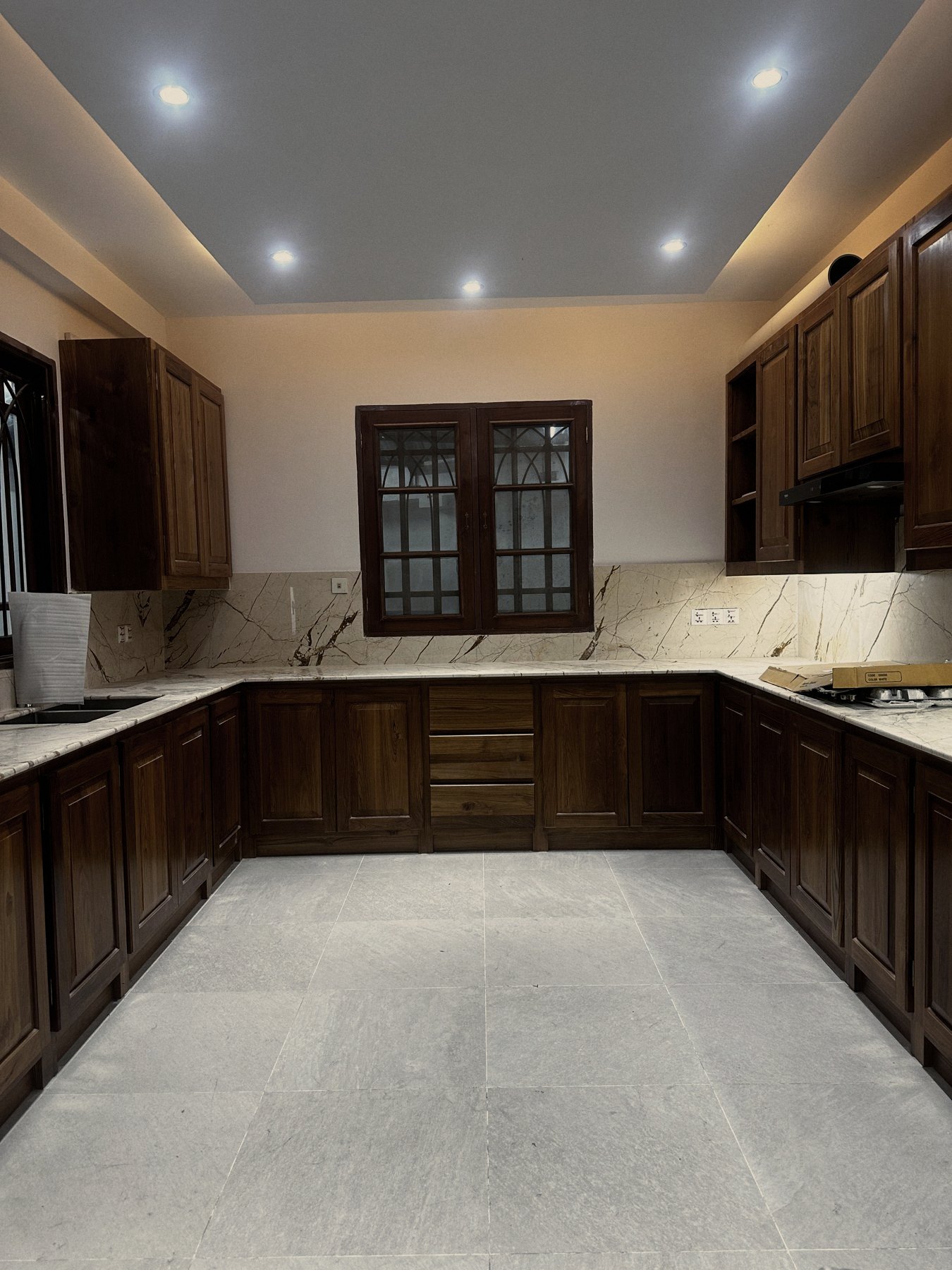 Fitted teak kitchen with marble