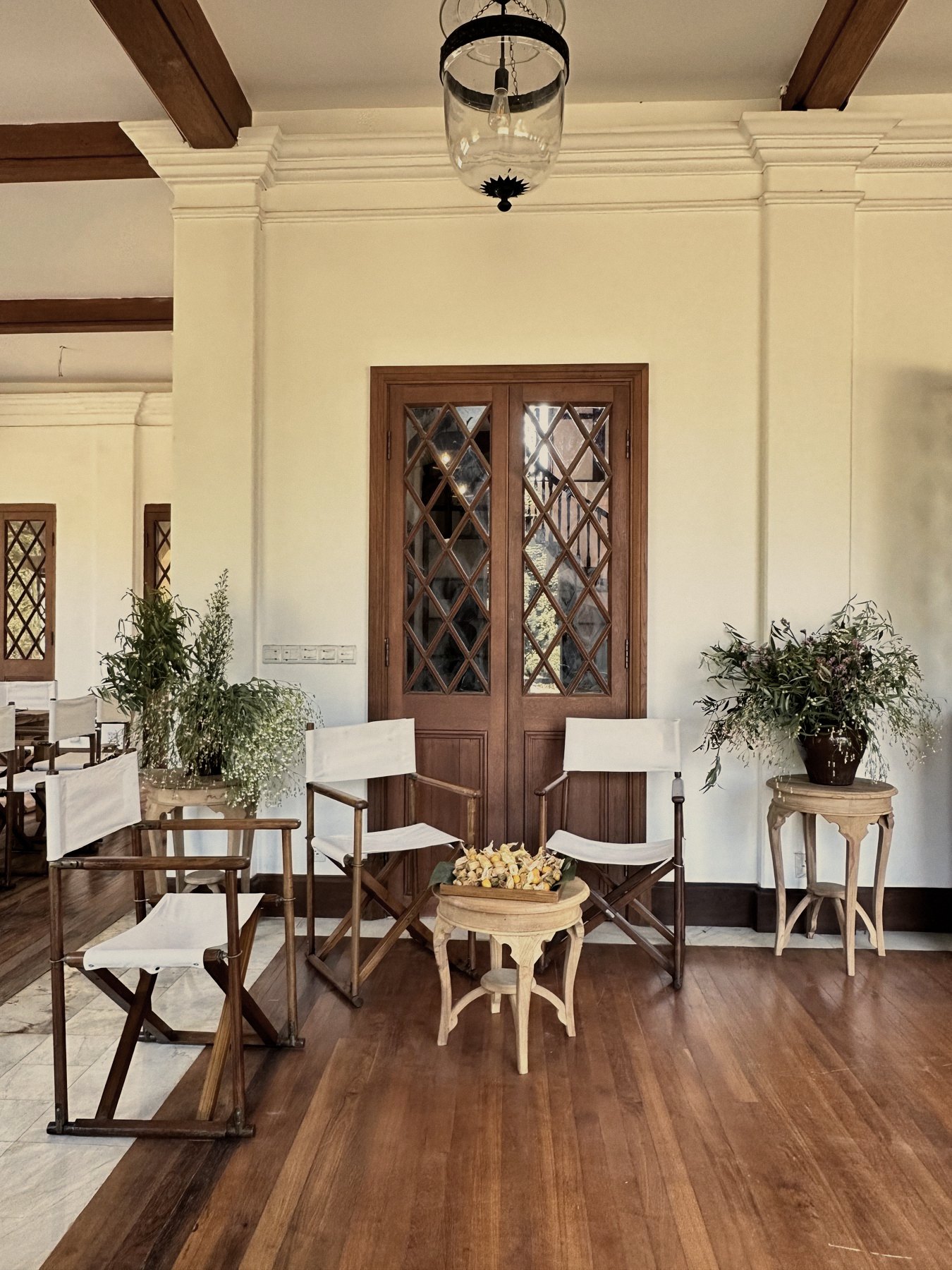 Veranda with directors chairs and lattice doors