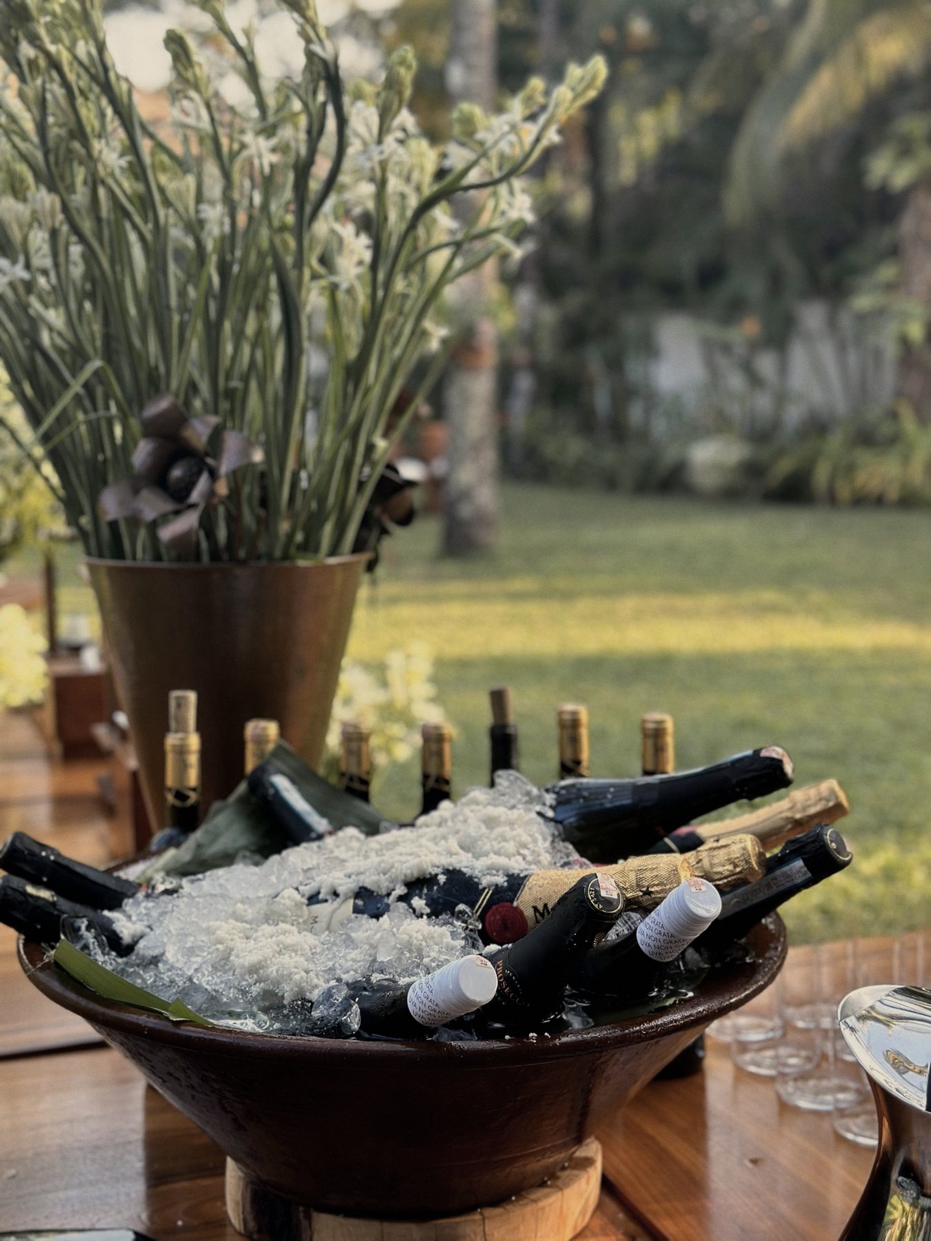 Champagne on ice in a teak bowl