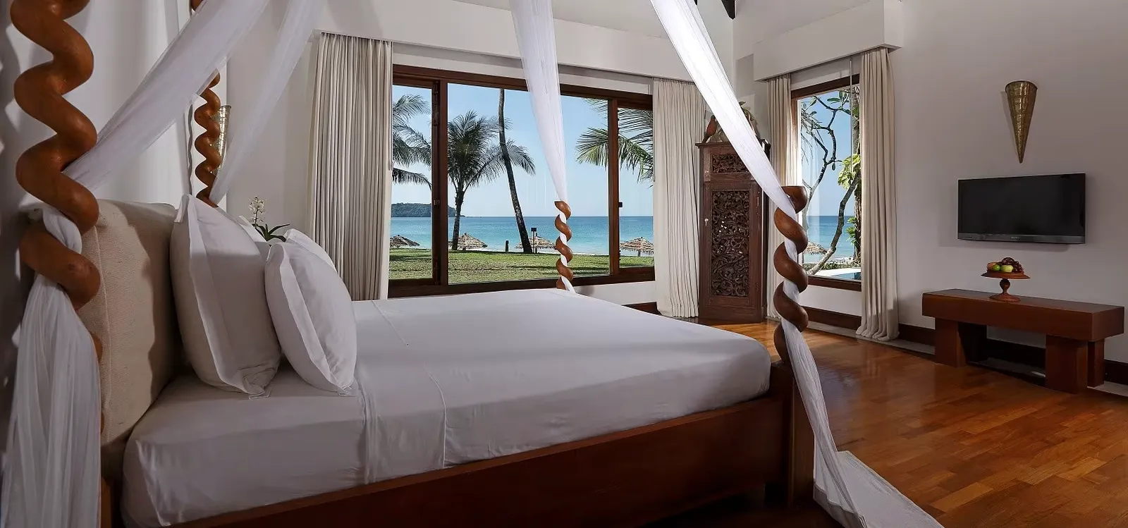 Ngapali Bay villa bedroom, twisted teak posts